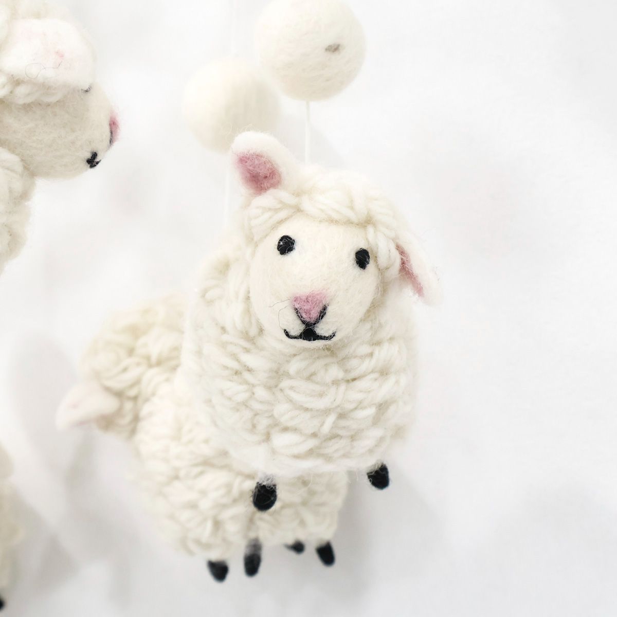 Cute handmade baby mobile with soft white lambs, eco-friendly wool nursery decoration