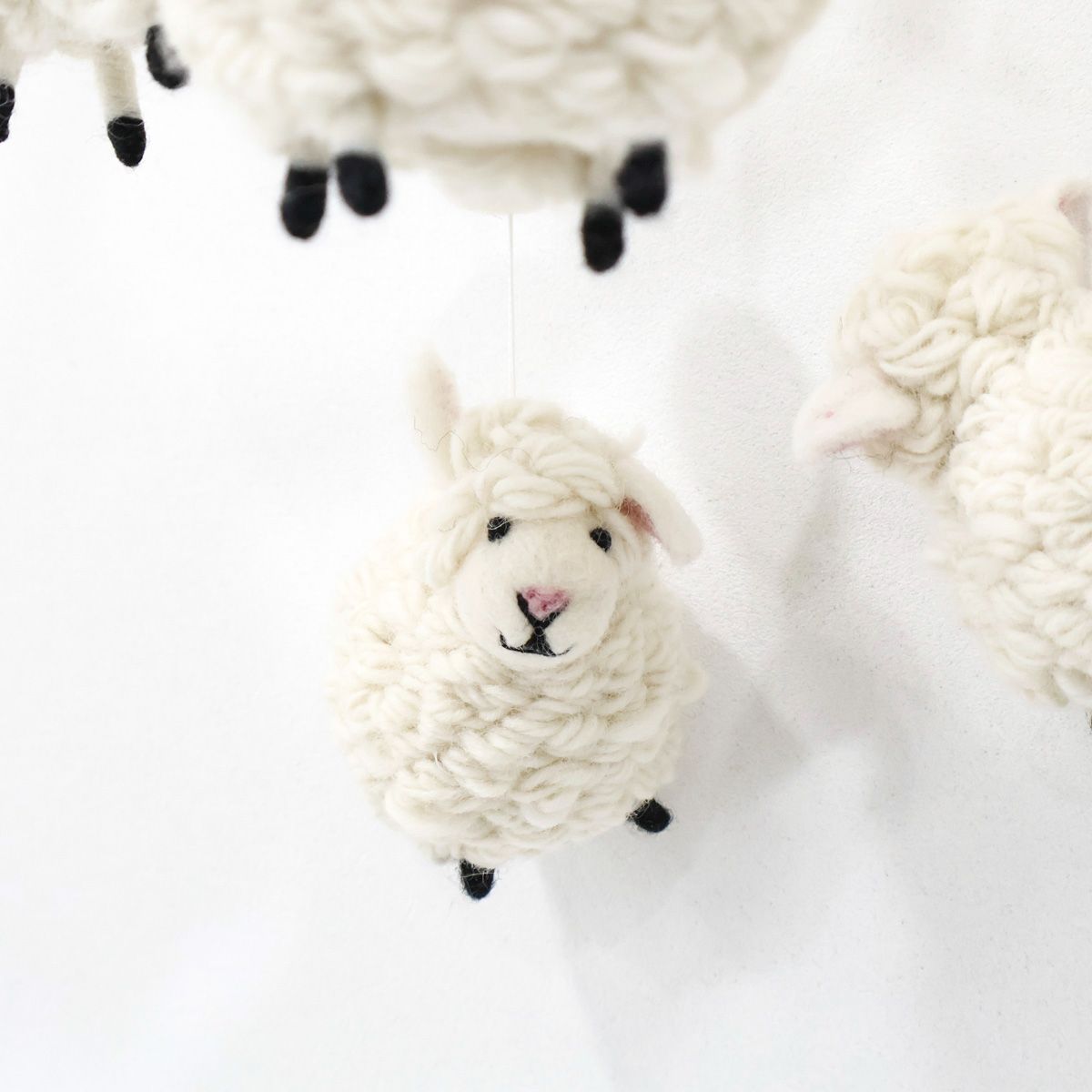 Cute handmade baby mobile with soft white lambs, eco-friendly wool nursery decoration