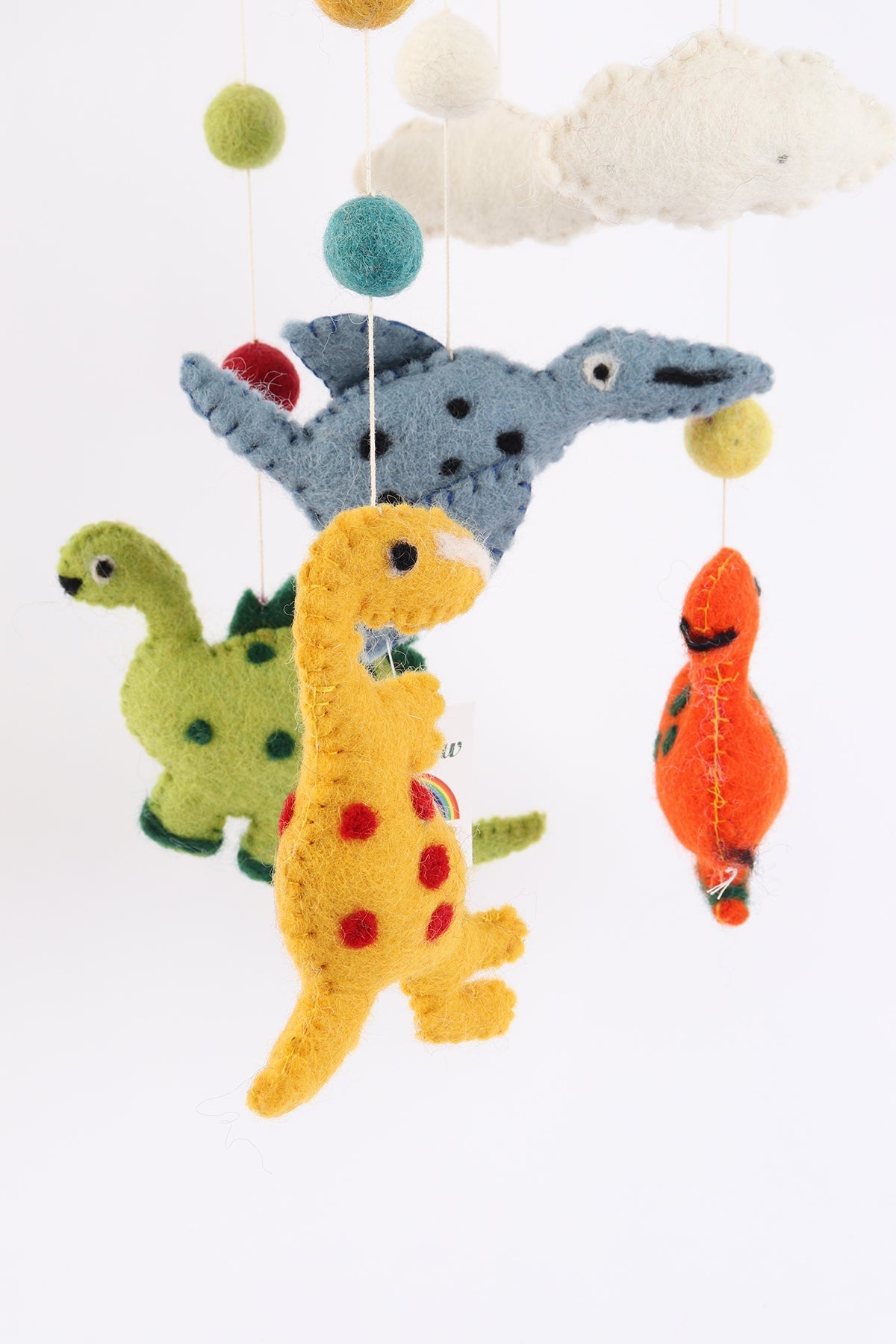Handmade wool baby mobile featuring herbivorous dinosaurs and a pterosaur, eco-friendly nursery decoration from Nepal