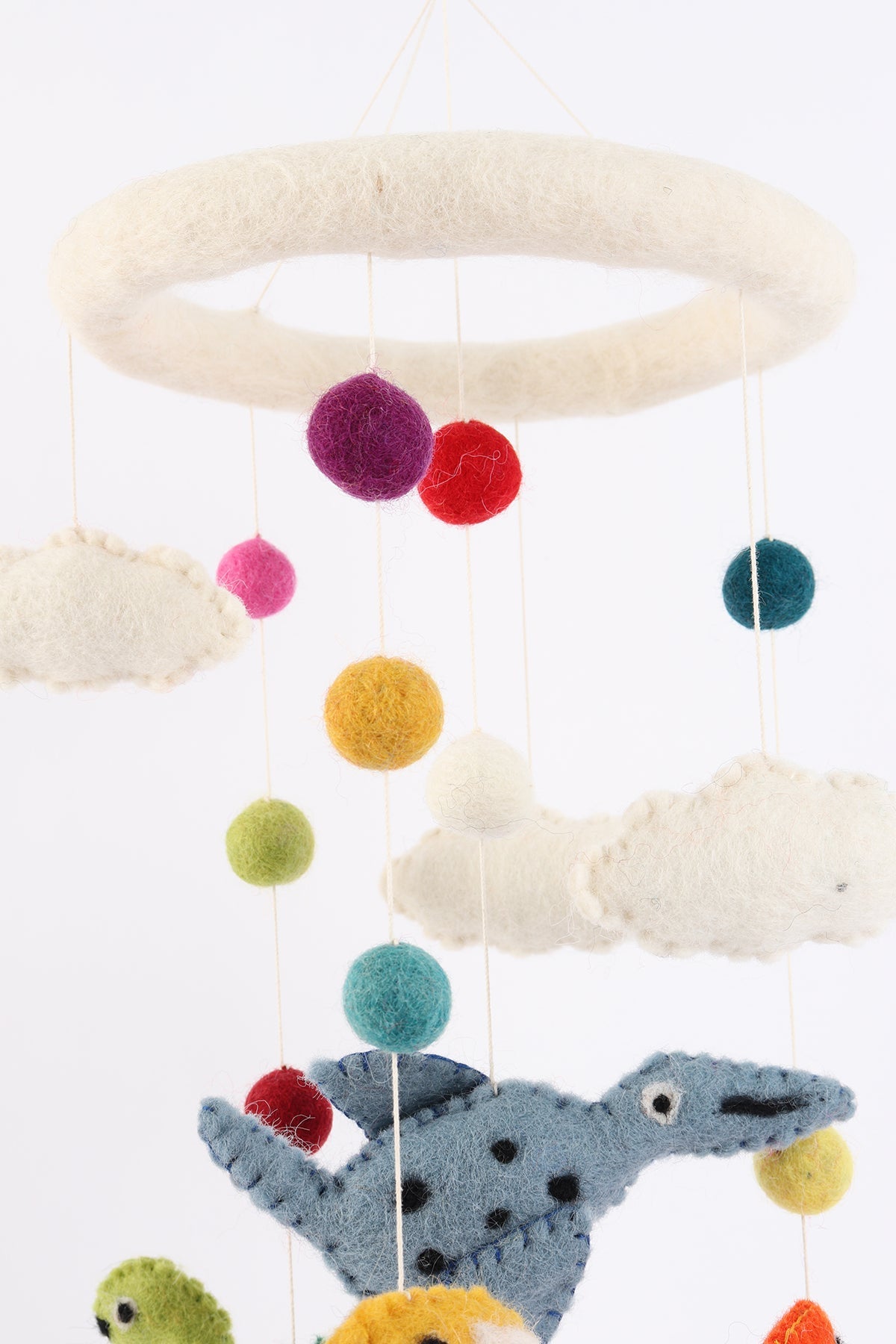 Handmade wool baby mobile featuring herbivorous dinosaurs and a pterosaur, eco-friendly nursery decoration from Nepal