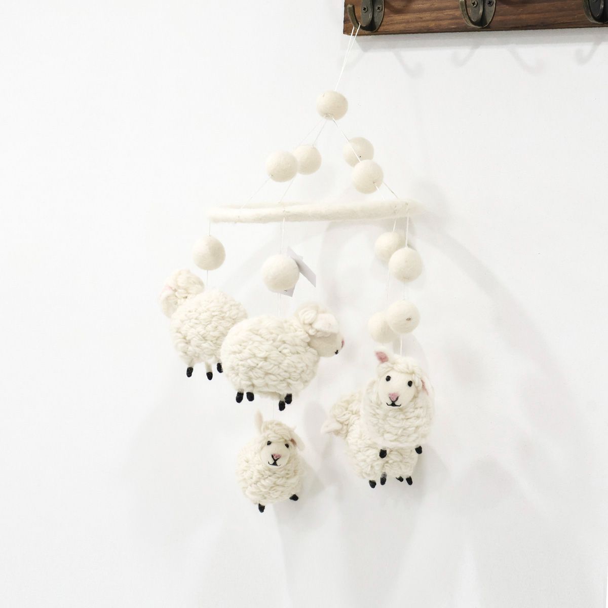 Cute handmade baby mobile with soft white lambs, eco-friendly wool nursery decoration