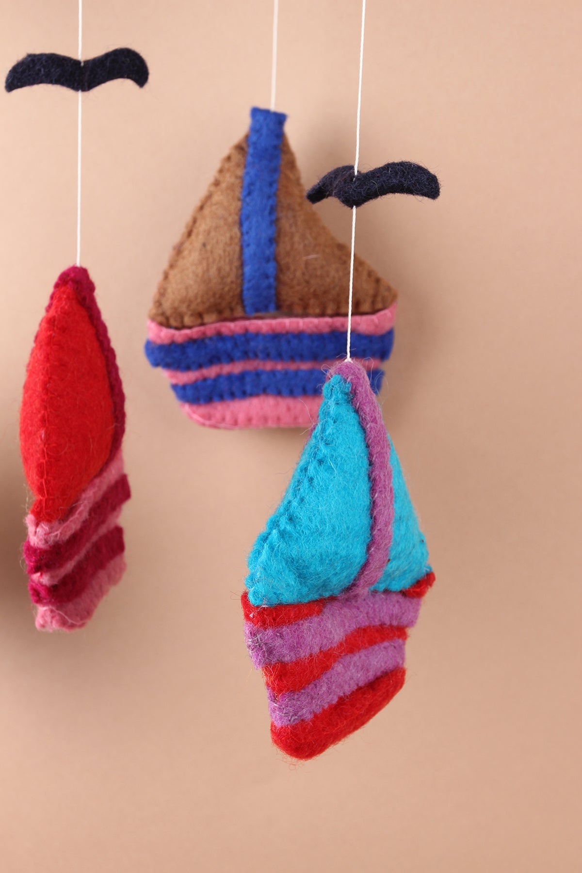 Felt sailboat baby mobile handmade with wool, eco-friendly nursery gift made in Nepal