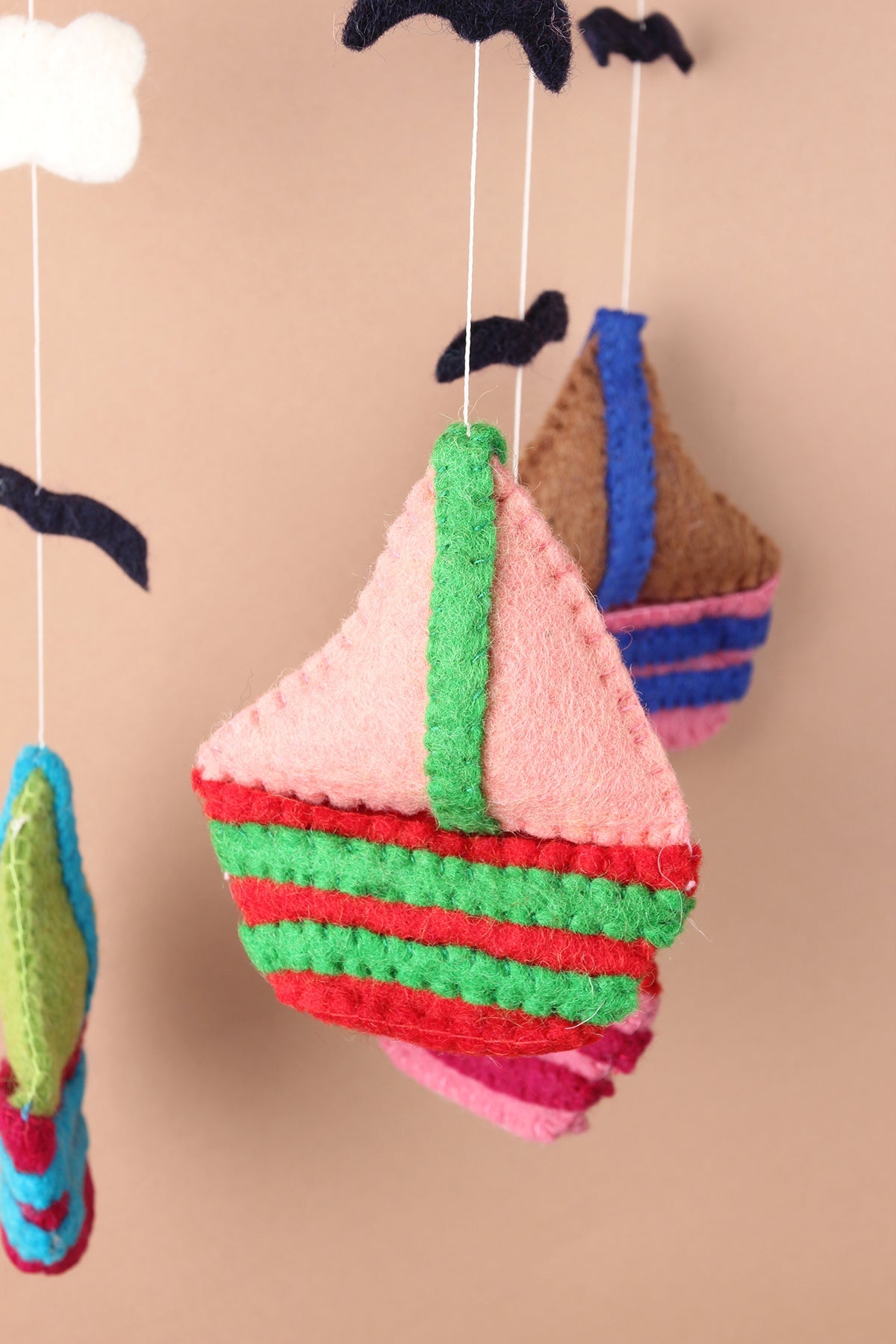 Felt sailboat baby mobile handmade with wool, eco-friendly nursery gift made in Nepal