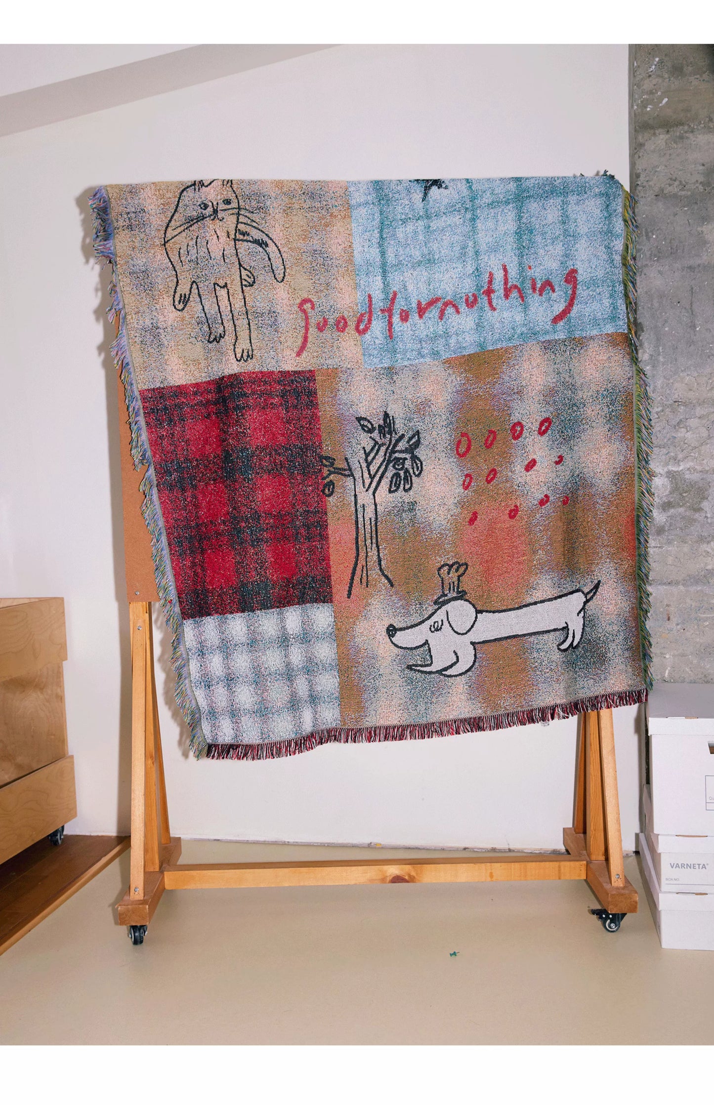 Goodfornothing is nothing like nothing in a vintage checked puppy art tapestry sofa blanket knitted blanket embellishment