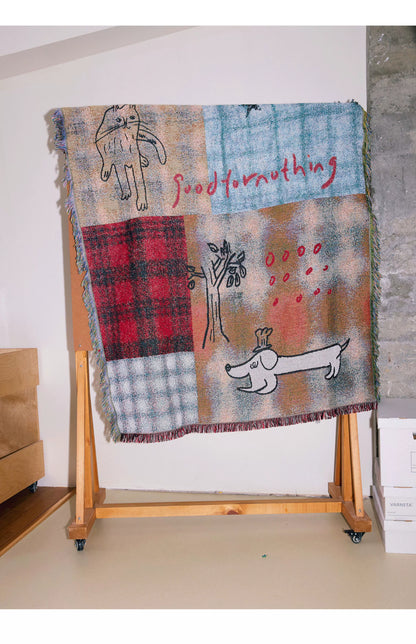 Goodfornothing is nothing like nothing in a vintage checked puppy art tapestry sofa blanket knitted blanket embellishment