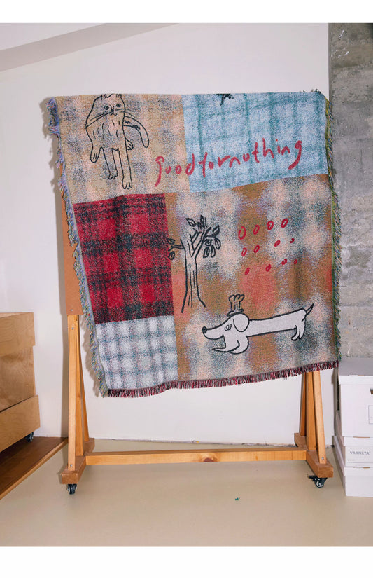 Goodfornothing is nothing like nothing in a vintage checked puppy art tapestry sofa blanket knitted blanket embellishment