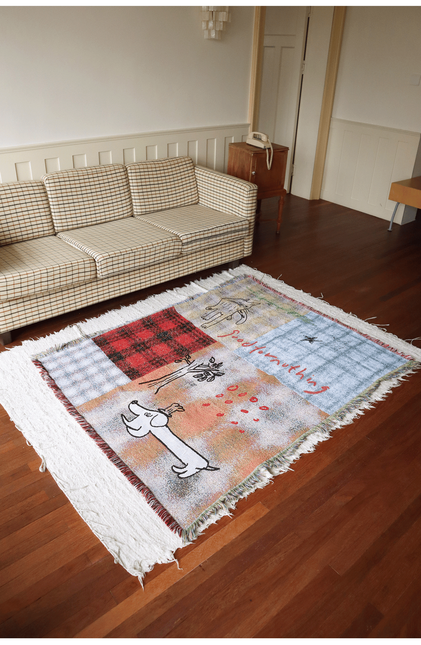 Goodfornothing is nothing like nothing in a vintage checked puppy art tapestry sofa blanket knitted blanket embellishment