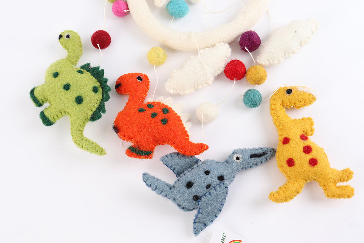 Handmade wool baby mobile featuring herbivorous dinosaurs and a pterosaur, eco-friendly nursery decoration from Nepal