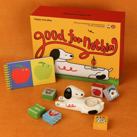 Dog candle holder gift box with ceramic puppy, tealights, and illustrated notebook in colorful packaging