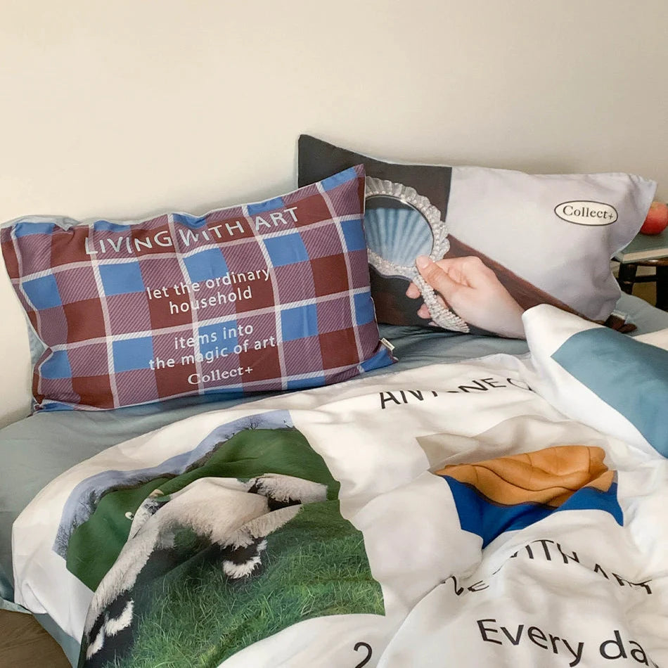 Complete 4-piece bedding set with artistic collage and blue reverse