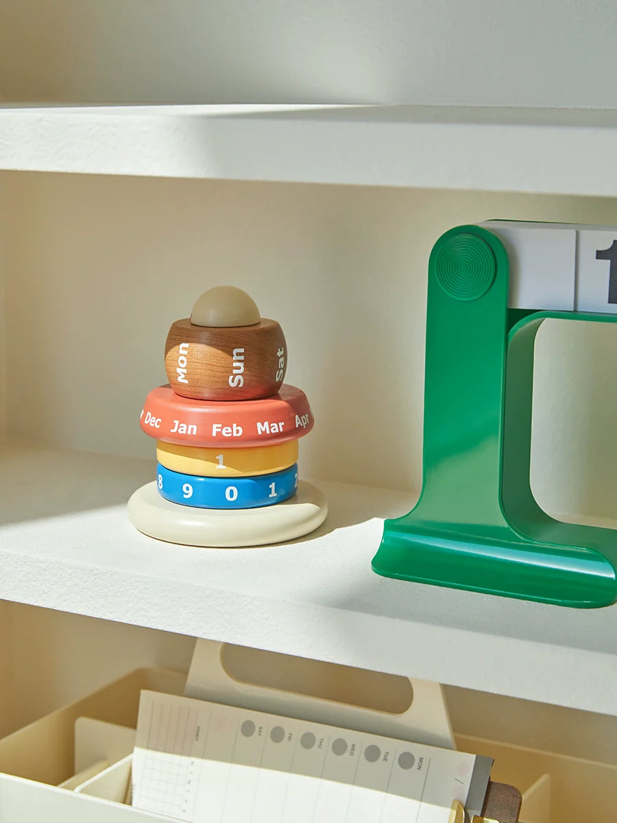 Wooden modular calendar styled on bookshelf with radio
