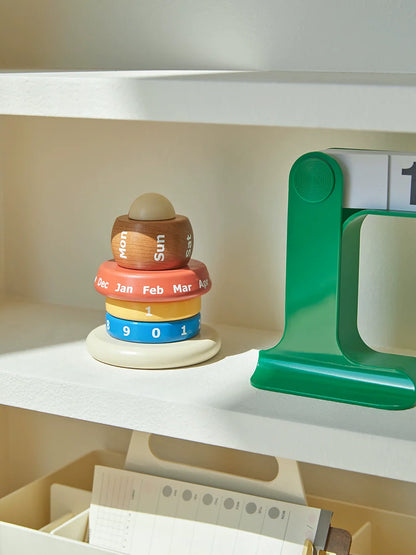 Wooden modular calendar styled on bookshelf with radio
