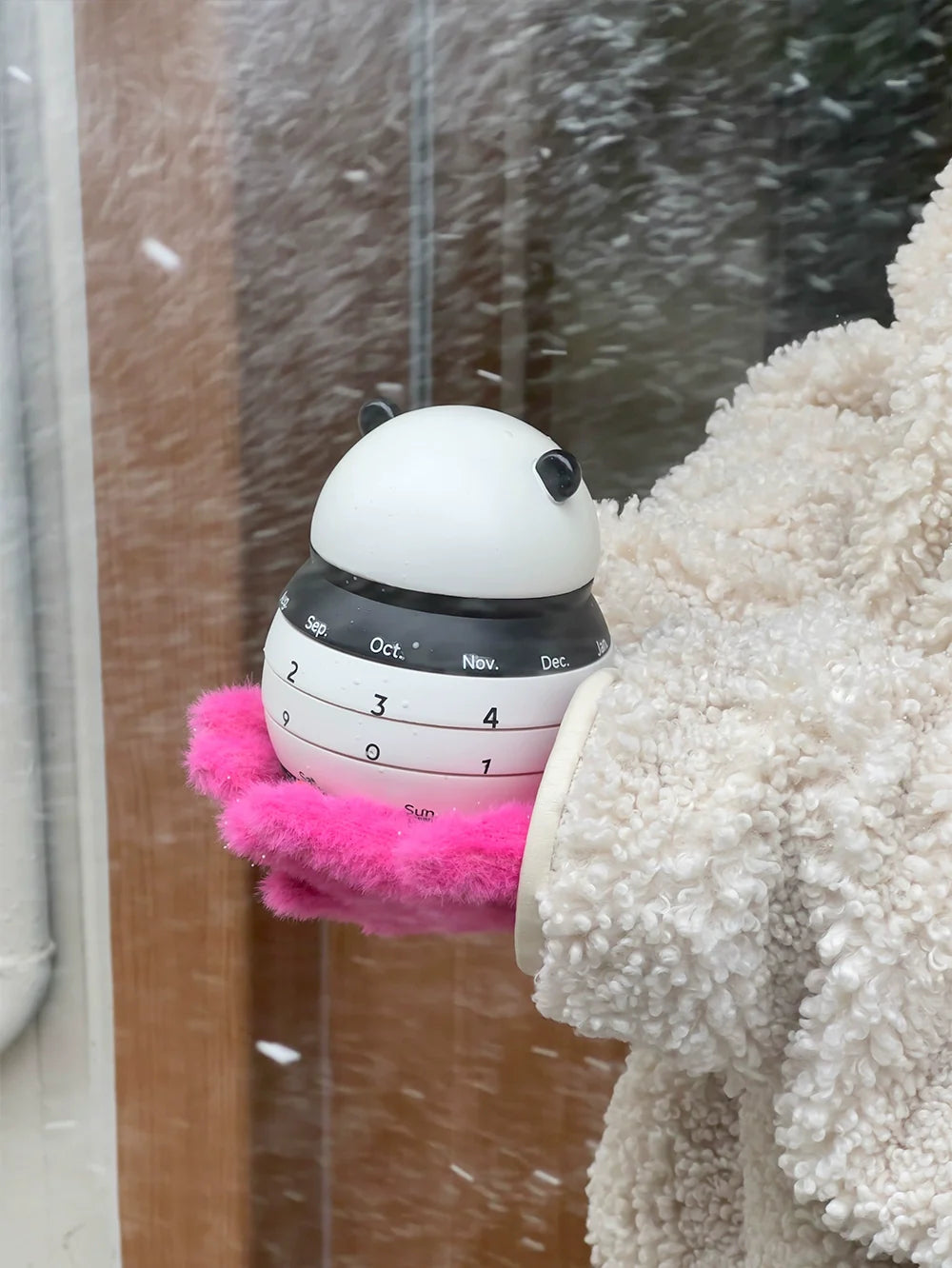 Cute panda calendar styled in cozy home setting
