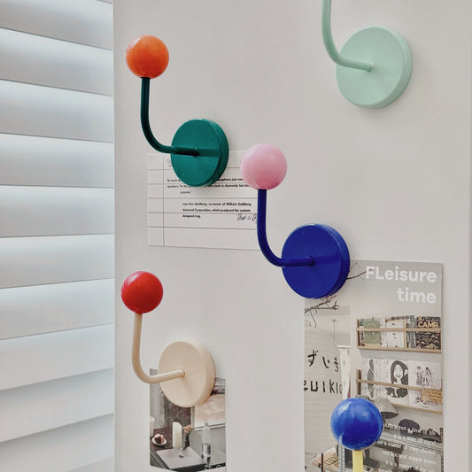 Colorful wall hooks used on fridge or metal door
